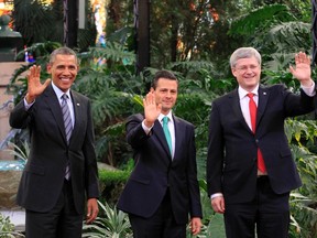 U.S. President Barack Obama, left, Mexico's President Enrique Pena Nieto and Prime Minister Stephen Harper, right, pose for an official photo at the North American Leaders' Summit in Toluca near Mexico City, February 19, 2014. (REUTERS/Henry Romero)