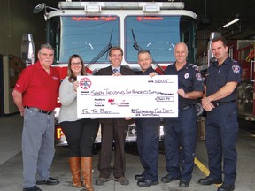 CONTRIBUTED PHOTO
Tillsonburg Firefighters Association, with generous support from Scotiabank, presented $7,661.54 to Muscular Dystrophy Canada Monday afternoon at the Tillsonburg Fire Station. From left are: John Boe and Carrie Gibson from Muscular Dystrophy Canada; David Abrams from Scotiabank; and firefighters John Kovacs, Dave Metselaar and Gary Wall.