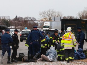 Police detain a group of protesters who blocked Interstate 93 southbound during the morning rush hour in Somerville, Massachusetts January 15, 2015. (REUTERS/Brian Snyder)