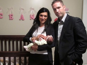 Valerie Gelinas and Jean-Francois Bussiere-Bourdages are pictured with their daughter Oceane. (CAMILLE LAURIN-DESJARDINS/QMI Agency)