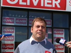 Andrew Olivier, then-Liberal candidate for Sudbury, makes a point at a press conference outside his campaign office on Thursday, June 5, 2014. (JOHN LAPPA/QMI AGENCY)