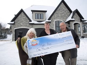 Dream Lottery grand prize winners Mary Anic, centre, and friends Marcy and Frank DiMaria pose outside a dream home on Rosecliffe Terrace in London Thursday.
DEREK RUTTAN/The London Free Press/QMI Agency