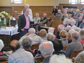 Sarnia native Paul Wells, political editor of Maclean's Magazine, speaks at the Central Forum at Central United Church in 2013. He's returning to wrap up this year's speaker series with a Feb. 24 talk. (Observer file photo)