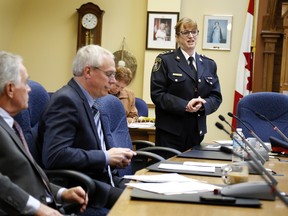 Belleville Police Chief Cory MacKay, right, and members of Belleville Police Services Board, Counc. Jack Miller, centre, and newly-appointed member Bradley Devolin, are seen during the board's first meeting of 2015 at city hall Thursday morning. - JEROME LESSARD/THE INTELLIGENCER/QMI AGENCY