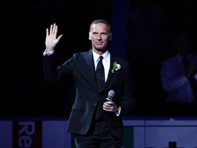 Buffalo Sabres former goalie Dominik Hasek waves to the crowd as he takes the ice during his ceremony to get his number retired prior to a game against the Detroit Red Wings at First Niagara Center on Jan. 13, 2015. (Timothy T. Ludwig/USA TODAY Sports)