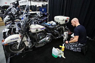 Cst. D Burroughs polishes his Harley Davidson Police Special during set up for the 2015 Motorcycle and ATV Show Edmonton in Edmonton, Alta., on Thursday, Jan. 15, 2015. Codie McLachlan/Edmonton Sun/QMI Agency