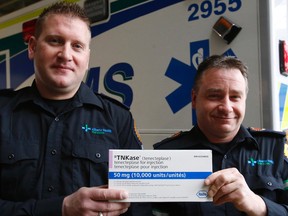 Paramedic Randall Brosnikoff (left) and EMT Chris Cowling hold a box of TNKase (a clot-buster) at the University of Alberta Hospital in Edmonton, Alta., on Thursday Jan.15, 2015. The two first responders injected TNKase into Debbie Robertson, a 57-year-old mother of three when she was suffering a heart attack in Sept. 2014. The life saving drug is part of northern Alberta's Vital Heart Response system, Robertson is healthy and is very grateful for the emergency care she received. Tom Braid/Edmonton Sun