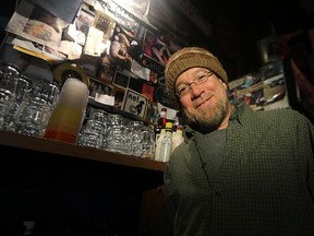 Times Changed High & Lonesome Club president/janitor John Scoles is seen behind the bar at the beloved Main Street honkytonk on Wed., Jan. 14, 2015. The club celebrates its 14th anniversary this weekend.
