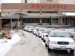 Police cars are lined up at the Victoria Hospital emergency room entrance. (Free Press file photo)