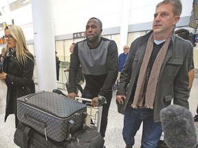Toronto FC’s newest acquisition Jozy Altidore (middle) arrives at Pearson International Airport from London on Thursday. (DAVE ABEL/Toronto Sun)