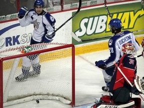 Sudbury Wolves forward David Zeppieri, top, celebrates his first goal of the season and first of his OHL career against Spitfires goaltender Brendan Johnston at WFCU Centre on Thursday. Wolves teammate Jonathan Duchesne joins the celebration in first period.