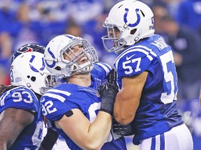 Colts linebacker Josh McNary (right), celebrating a sack with Bjoern Werner, has been barred from practising and playing after being arrested and charged with rape on Wednesday. (AFP)