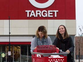 Michelle Hyde, left, and Ally Carlson leave the Target Store at Kingsway Mall on Thursday. Target announced that it will be closing its 133 stores across Canada. (DAVID BLOOM/EDMONTON SUN)