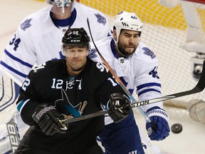 Maple Leafs defenceman Roman Polak checks Patrick Marleau of the San Jose Sharks on Jan. 15. (USA Today Sports