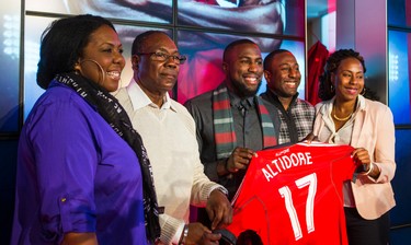 Jozy Altidore (middle)- signed by Toronto FC - poses for a photo with his family after a press conference at the Air Canada Centre in Toronto, Ont. on Friday January 16, 2015. Ernest Doroszuk/Toronto Sun/QMI Agency