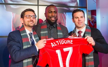 Jozy Altidore  (middle)- signed by Toronto FC - during a photo-op after a press conference at the Air Canada Centre in Toronto, Ont. on Friday January 16, 2015. On the left - Toronto FC GM Tim Bezbatchenko and on the right is head coach Greg Vanney.  Ernest Doroszuk/Toronto Sun/QMI Agency