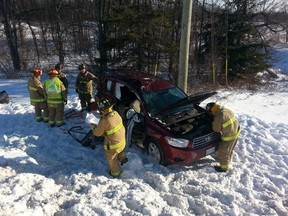 A woman was trapped and had to be extricated by Ottawa fire crews after this Friday-morning crash along Prince of Wales at Barnsdale Rd. Several crashes occurred on snow-swept south end roads. (DOUG HEMPSTEAD Ottawa Sun)
