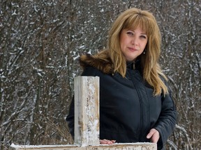 Robin Ferguson at a cross beside Tank Hill in honour of her son.  It was the first time Robin Ferguson had visited the hill where her son was killed in five years. (Pete Fisher/QMI Agency)