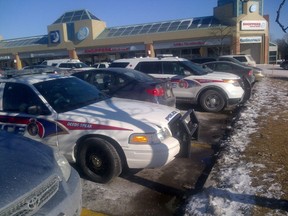 Police at the scene of a carjacking outside a Shoppers Drug Mart in Markham Friday, Jan. 16, 2015. (Terry Davidson/Toronto Sun)