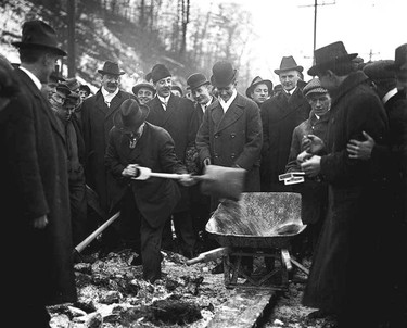 The photographer snapped this photograph on Jan. 16, 1915, exactly 100 years ago last Friday and shows the then City of Toronto Mayor Tommy Church looking on as several of his city controllers take turns digging up the first few pieces of sod for one of the footings of the new Bloor St. Viaduct. The ceremony took place next to the ice covered west bank of the Don River, a place known for years to the hundreds of children who learned to swim in the river as Sandy Hook. Standing to the Mayor's left is the assistant city clerk James Somers while gathered around are some of the employees of the Quinlan & Robertson Company, the Montreal contractors who were to build the massive project. (City of Toronto Archives photo)