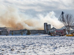 Firefighters from Strathroy-Caradoc, Glencoe, and Wardsville were kept busy with a barn fire at a hog farm in Appin on Friday. DEREK RUTTAN/ The London Free Press /QMI AGENCY