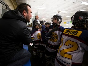 Coach Tyler Gayford gives some tips to the Whitemud West Snipers.