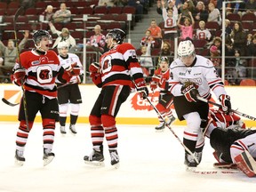 Ottawa 67's Trent Mallette, left, and Sam Studnicka celebrate Studnicka's first-period goal against the Owen Sound Attack Friday at TD Place. (Chris Hofley/Ottawa Sun)