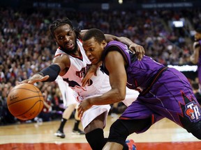 Hawks forward DeMarre Carroll (left) gets to the ball ahead of Raptors guard Kyle Lowry at the ACC last night. (USA TODAY)