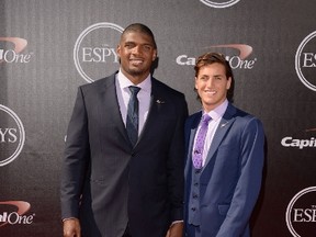 NFL player Michael Sam with boyfriend Vito Cammisano attends The 2014 ESPYS at Nokia Theatre L.A. Live on July 16, 2014. (Jason Merritt/Getty Images/AFP)