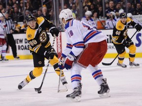 David Pastrnak, getting off a shot against Rangers' Marc Staal, has given an offensive spark to the Bruins' top line. (AFP photo)