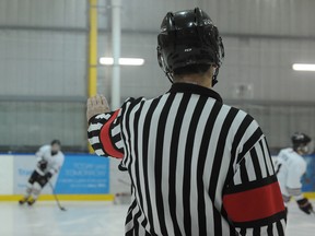 Referee Ben Isleifson calls a game at Max Bell Arena in SE Calgary, Alta. on Wednesday January 14, 2015. Stuart Dryden/Calgary Sun/QMI Agency