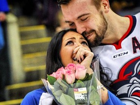 Minor pro hockey player Justin Sawyer proposed to his girlfriend during an intermission on Friday. (Instagram/Rick Bacmanski Photo Artistry)