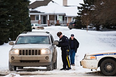 RCMP officers are on scene at a home in Sturgeon County after two RCMP officers were shot in St. Albert, Alta., on Saturday, Jan. 17, 2015. Codie McLachlan/QMI Agency