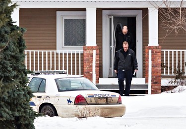 RCMP officers are on scene at a home in Sturgeon County after two RCMP officers were shot in St. Albert, Alta., on Saturday, Jan. 17, 2015. Codie McLachlan/QMI Agency