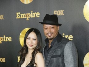 Terrence Howard, right, and his wife Miranda pose at the "Empire" premiere party in Hollywood, California January 6, 2015. (REUTERS/Danny Moloshok)