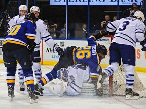 St. Louis Blues centre Paul Stastny (26) falls on to Toronto Maple Leafs goalie Jonathan Bernier during the second period at Scottrade Center in St. Louis on Saturday. (Jeff Curry-USA TODAY Sports)