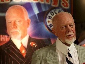 Hockey commentator Don Cherry talks with a photo of himself in the background at the Original Hockey Hall of Fame at the Invista Centre on September 26, 2013. (IAN MACALPIN/QMI AGENCY/Files)