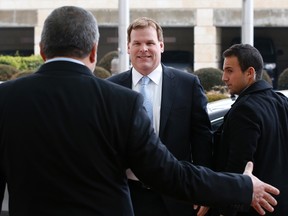 Foreign Minister John Baird is greeted by his Israeli counterpart Avigdor Lieberman, left, upon his arrival for their meeting in Jerusalem on Jan. 18, 2015. (REUTERS/Ronen Zvulun)