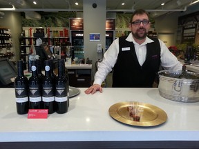 Dominic Gamble was on the job at the Wine Rack in the Byward Market Sunday, Jan. 18, 2105 just two days after the New York Times review of the wine shop caused a buzz.
KEATON ROBBINS/OTTAWA SUN/QMI AGENCY