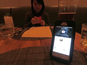 One of the popular new dining apps - Tab - is pictured in use at The Chase Restaurant. (MICHAEL PEAKE, Toronto Sun)