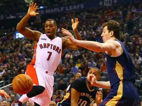 Kyle Lowry of the Toronto Raptors loses the ball with attacking Eric Gordon and Omer Asik of the New Orleans Pelicans on Sunday. (Dave Abel/Toronto Sun/QMI Agency)