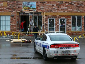 Workers start making repairs after an SUV slammed into a Brampton restaurant. (DAVE ABEL, Toronto Sun)