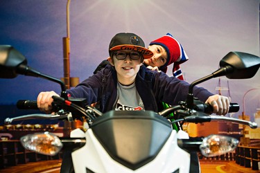 Brothers James Crane, 11, left, and Zac, 6, try out a Honda CB300F during the 2015 Motorcycle and ATV Show Edmonton at the Edmonton Expo Centre in Edmonton, Alta., on Sunday, Jan. 18, 2015. Codie McLachlan/Edmonton Sun/QMI Agency
