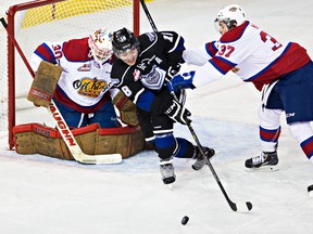 Edmonton's Dysin Mayo shoves Victoria's Brandon Magee during the Edmonton Oil Kings' WHL hockey game against the Victoria Royals at Rexall Place in Edmonton, Alta., on Sunday, Jan. 18, 2015. Codie McLachlan/Edmonton Sun/QMI Agency