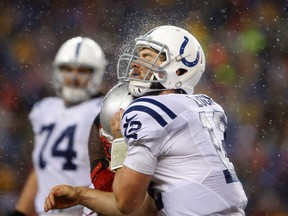 It was that kind of night for Indianapolis Colts quarterback Andrew Luck — seen here getting hammered by Patriots defensive tackle Vince Wilfork during second-half action in the AFC Championship Game at Gillette Stadium. (USA TODAY SPORTS)