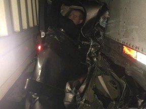 Kaleb Whitby, 27, escaped with minor injuries after being sandwiched between two semis. (Twitter)
