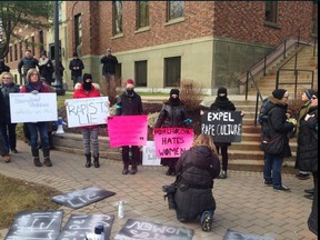 Protesters at Dalhousie University demanded the dentistry students behind a Facebook group full of rape jokes be expelled from school on Dec. 19, 2015. Thirteen  fourth-year dental students were suspended for their alleged involvement in the group. (Yalitsa Riden/Twitter)