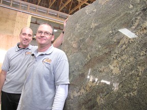 Kevin Deacon (left) and Brad Goldsmith, owners of Southwest Granite & Glass, are pictured in their warehouse at Keil Drive South in Chatham. The four-year-old company was named feature industry of the month by the Chatham-Kent Chamber of Commerce and the Municipality of Chatham-Kent. 
Blair Andrews/Chatham This Week