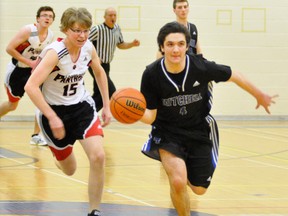 Nick Jung (right) of the MDHS senior boys basketball team breaks away with the ball during Huron-Perth conference action last Monday, Jan. 12. ANDY BADER/MITCHELL ADVOCATE