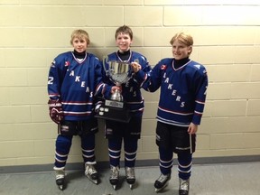 Mitchell-area residents on the Huron-Perth Minor Pee Wee Lakers, Logan Harmer (left), Aiden McMann and Tanner Dietz, pose with the Great Lakes Cup Tournament trophy in Stratford Sunday, Jan. 18.  SUBMITTED